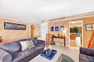 a living room with a couch and a table at Generations in Douglas +36 photos