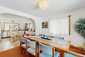 a kitchen and dining room with a table and chairs at The Big Easy in Oak Bluffs +15 photos