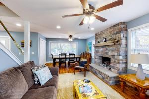 a living room with a couch and a fireplace at Beach House in Empire