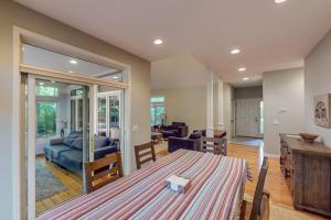 a living room with a table and a couch at Deer Park 9 in Glen Arbor