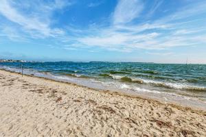 a sandy beach with the ocean in the background at Yarmouth Bliss in Yarmouth
