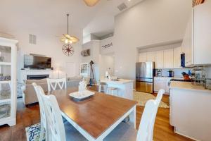 a kitchen and dining room with a table and chairs at Bear Trap Dunes---26 Willow Oak Ave in Ocean View