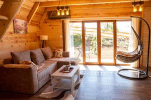 a living room with a couch and a table at Bugen Villa III in Žabljak