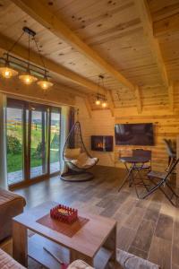 a living room with a hammock in a cabin at Bugen Villa III in Žabljak