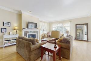 a living room with two couches and a fireplace at Beacon Court D in Douglas