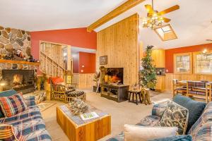 a large living room with a fireplace and a couch at Whispering Pines in Thompsonville