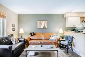 a living room with a couch and a table at Wintergreen Condo, Unit 540 in Thompsonville