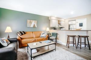 a living room with a couch and a table at Wintergreen Condo, Unit 540 in Thompsonville +29 photos