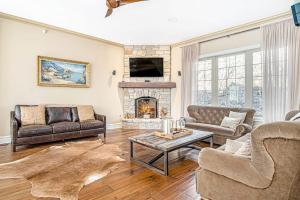 a living room with a couch and a fireplace at Eagles Nest in New Buffalo