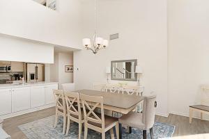 a kitchen and dining room with a table and chairs at Sea Colony - 55021 Pine Lake in Bethany Beach