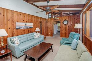 a living room with a couch and two chairs at Camp David in Frankfort