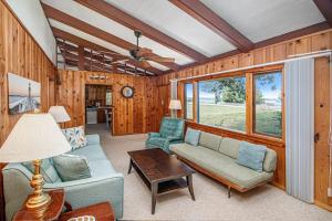 a living room with a couch and a table at Camp David in Frankfort