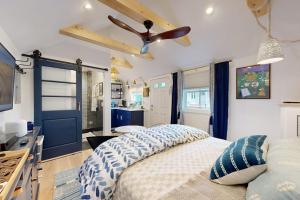 a bedroom with a bed and a ceiling fan at Sankofa Studio in Oak Bluffs