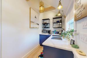 a kitchen with a sink and a counter at Sankofa Studio in Oak Bluffs