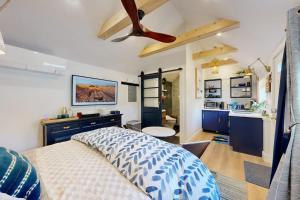 a bedroom with a bed and a ceiling fan at Sankofa Studio in Oak Bluffs