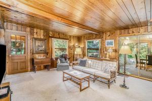a living room with a couch and a piano at Hal's Hideaway in Beulah