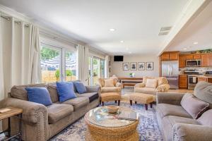 a living room with couches and a table at Surf's Up in New Buffalo