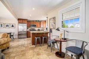 a kitchen with a couch and a table and chairs at Surf's Up in New Buffalo