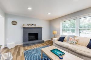 a living room with a couch and a fireplace at Mill Run Estates --- 31863 Mill Run Dr in Ocean View