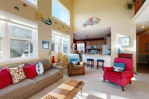 a living room with a couch and chairs and a kitchen at Wedgefield --- 23 Wedgefield in Ocean View