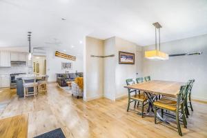 a dining room and kitchen with a table and chairs at Red Pine Retreat in Thompsonville
