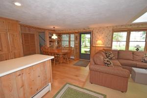 a living room with a couch and a table at Thorogood Glen in Empire