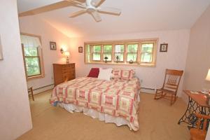 a bedroom with a bed and a ceiling fan at Thorogood Glen in Empire +25 photos