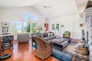 a living room with a couch and chairs at Blue Bear in Glen Arbor +21 photos