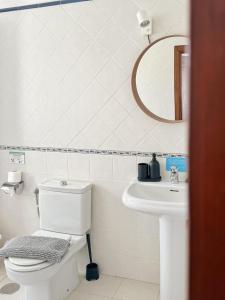 a bathroom with a toilet and a sink at Casa Lava in Punta Mujeres +21 photos