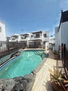 a swimming pool in the backyard of a house at Casa Lava in Punta Mujeres