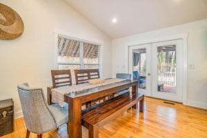 a dining room with a wooden table and chairs at Borrowed Thyme in Saugatuck