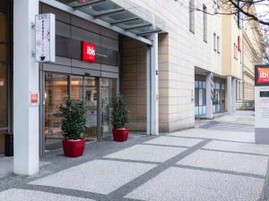 two plants in red pots outside of a building at Ibis Praha Wenceslas Square in Prague