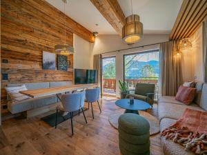 a living room with a couch and a table at Die Kramerei in Hollersbach im Pinzgau