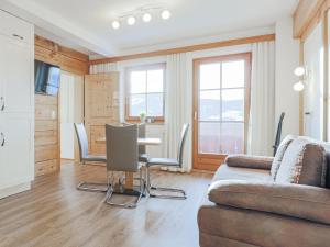 a living room with a couch and a table at Igl Hof Top 2 in Westendorf