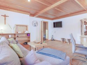 a living room with a couch and a table at Igl Hof Top 3 in Westendorf