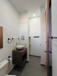 a bathroom with a sink and a toilet and a shower at Atardeceres casa de playa in Cartagena de Indias +19 photos