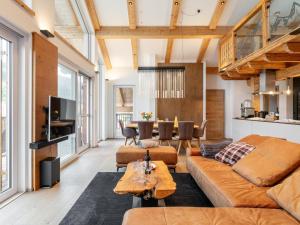 a living room with a couch and a table at Apart33 Top 1-33 Penthouse in Haus im Ennstal
