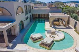 an aerial view of a house with a swimming pool at Villa Lavender by Villa Plus in Kolymbia