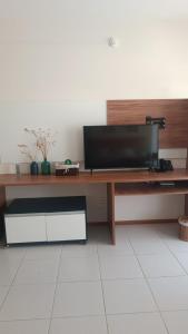 a desk with a television on top of it at Tree Bies in Entre Rios
