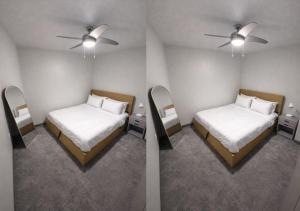 two beds in a room with two mirrors at Golden Fern Escape in Des Moines