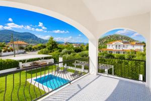 a view from the balcony of a house with a swimming pool at Villa Crystal in Dalyan