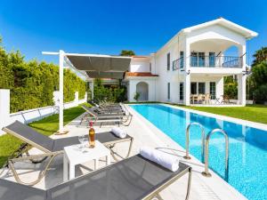 a villa with a swimming pool and a house at Villa Crystal in Dalyan