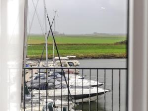 a group of boats are docked in the water at Zilte Haven in Kamperland