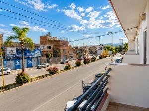 a view from the balcony of a building with a street at Hotel Valle del Huajucar in Calvillo