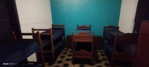 a room with four bunk beds and blue walls at 7 duendes in Salta