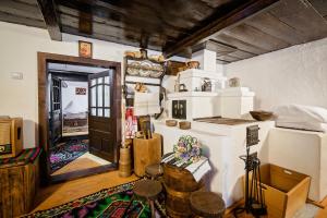 a room with a room with a door and a room with a room at Pension La Roata in Gura Humorului