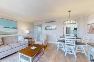 a living room with a couch and a table at Marco Beach Ocean Resort 801 in Marco Island