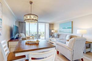 a living room with a couch and a table at Marco Beach Ocean Resort 801 in Marco Island