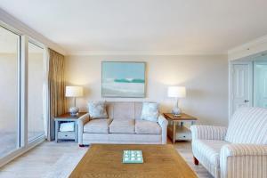 a living room with a couch and a table at Marco Beach Ocean Resort 801 in Marco Island