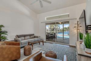 a living room with a couch and a table at Hook, Line, and Sunsets in Port Charlotte